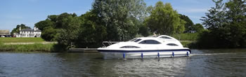 Holiday cruiser on the River Bure, Norfolk Broads